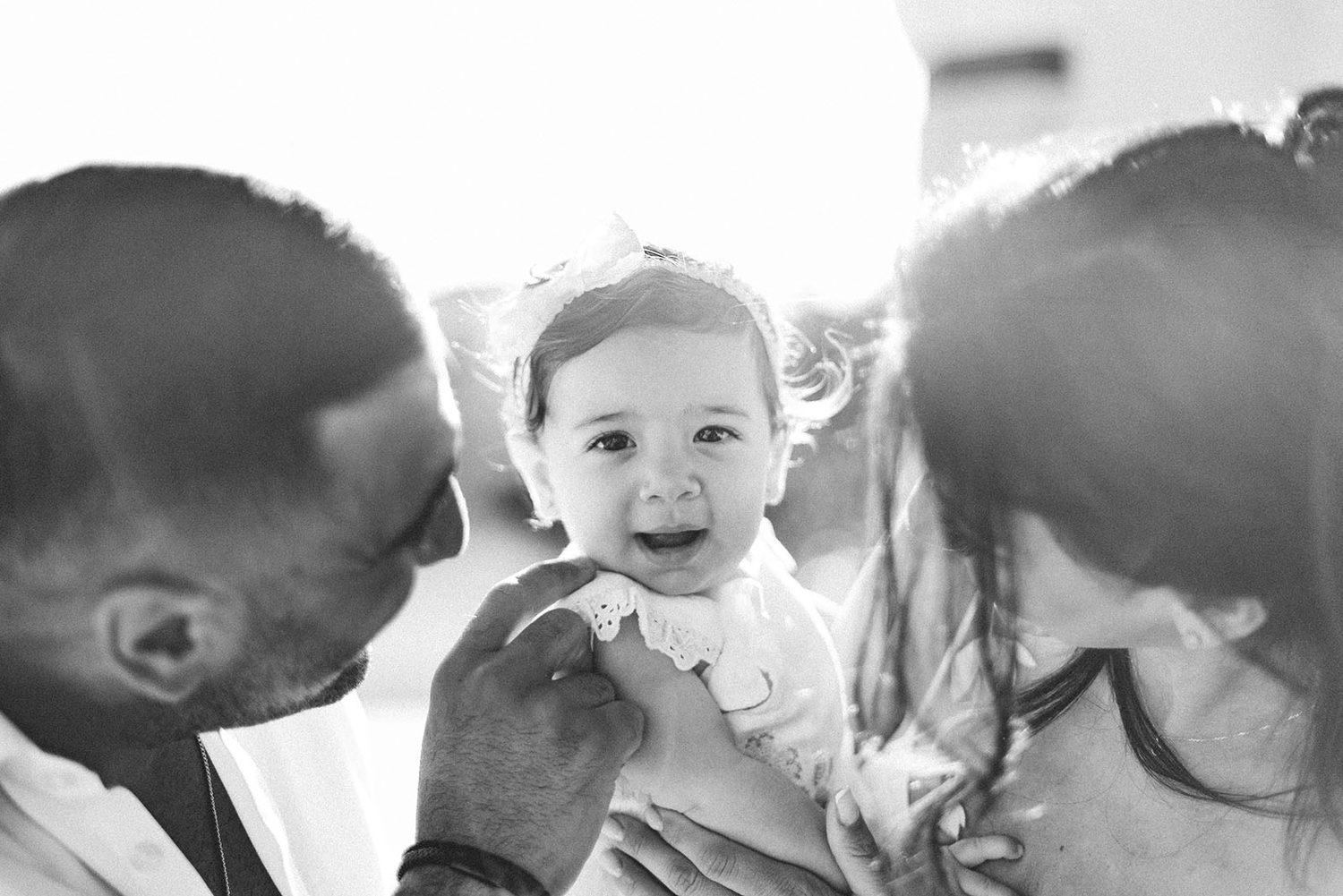 Black and white photo of mum and dad with baby Chloe, christening in Protaras