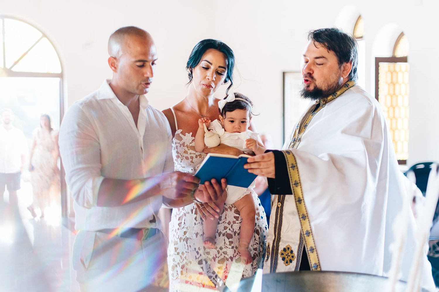 Godparents and parents with the priest holding baby Chloe, Protaras christening