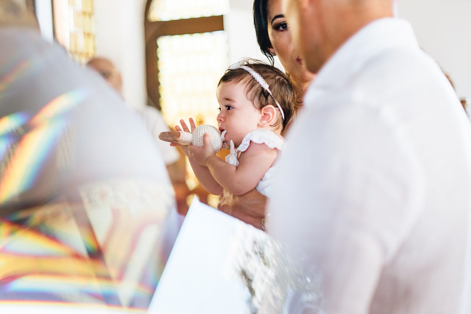Baby Chloe with golden light during the christening, Protaras